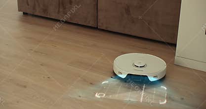 White robot vacuum cleaner scan laminate wood floor. Detectors help to recognize walls and objects and optimize cleaning
