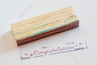 Congratulation stamped on paper
