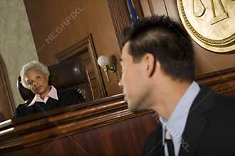 Judge And Witness Looking At Each Other