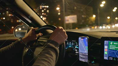 Drive night taxi street road man hand smartphone car town city