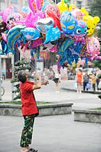 Chinese old man selling balloon
