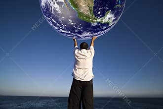 Man holding the planet earth