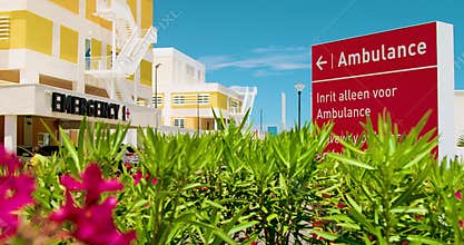 Exterior of hospital emergency entrance with big letters