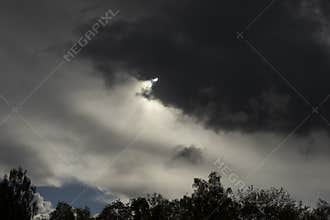 Cloud obscures sun. Grey sky. Cloudy weather