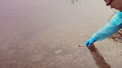 Ecological Water Sampling Hand Of Scientist Researcher Draws Water With Test Tube From Reservoir, Water Pollution Due To