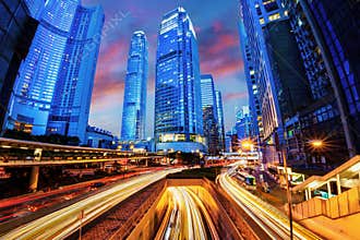 Light trails of fast moving traffic during evening sunset rush hour in downtown Hong Kong