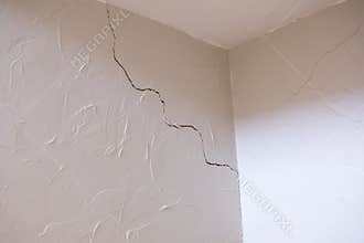 Subsidence crack in corner of wall and ceiling