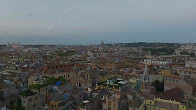 Trunk road leading around large cemetery in city at sunrise. Aerial view of Verano Monumental Cemetery. Rome, Italy