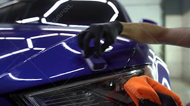 Hand applying of nano ceramic protective coat to protect car from scratches. 4k video process of apply ceramic layer on