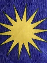 Macro of yellow star logo on blue background