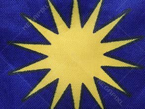 Macro of yellow star logo on blue background