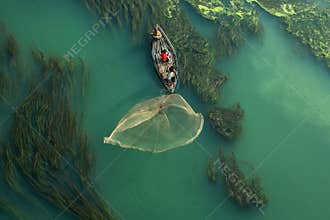 Traditional fishing in the algae river