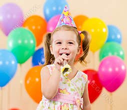 Happy child girl on birthday party