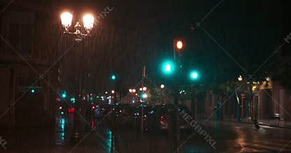 Rain pouring in the city at night
