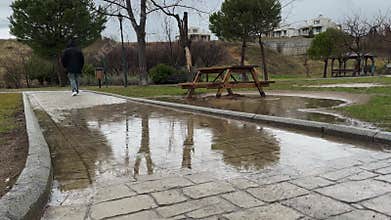 Walk In The Park While Raining, Man Wearing Hoodie Rainy Gloomy Day 2 Water Reflections