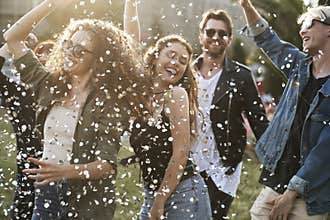 Group of caucasian young people dancing on music festival