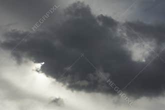 Cloud obscures sun. Grey sky. Cloudy weather