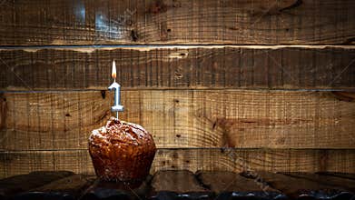 Background happy birthday pie or muffin with candles burning digit number 1. Festive card Happy Birthday on the background of