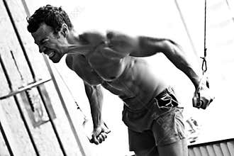 Bodybuilder hard training in the gym