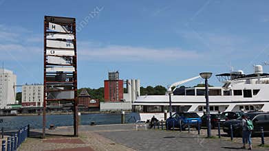 Flensburg, Germany - 13. June 2025: Letters of Phanomenta on a metal sign are changing, revealing different messages in Flensburg