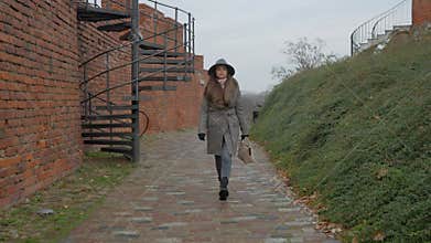 A tourist explores the fortifications and architecture of Warsaw\'s Old Town.