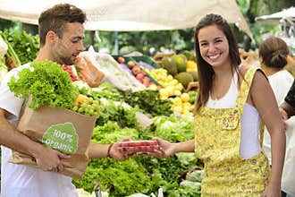 Small business owner selling organic fruits.