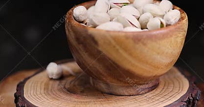 fried pistachio nuts in their shells with added salt