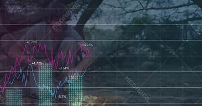 Man arriving at dusk, crouching and rekindling fire with tech charts rising, fading, peeling orange