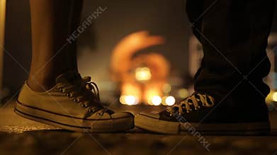 Boy and girl feeling love kissing in park
