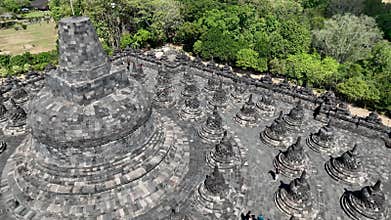 Aerial close up of stone stupas around the largest main stupa at Borobudur. The intricate detail of the stupas arround main big
