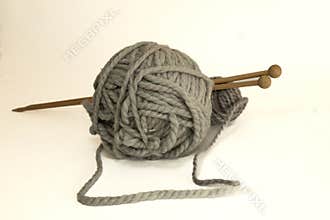 Cozy knitting: soft gray yarn with wooden needles