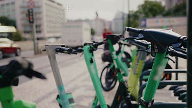 Close-Up Of Electric Scooters Parked On City Street In Portugal