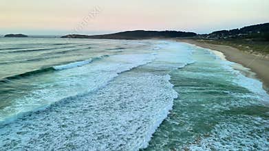 A Stunning Aerial View of Serene Ocean Waves at Dusk That Captivates the Senses and Inspires