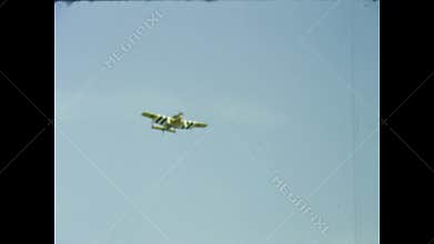 Vintage biplane performing aerobatics in uk skies