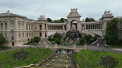 Aerial view of Palais Longchamp in Marseille, France. The grand architecture features a central fountain