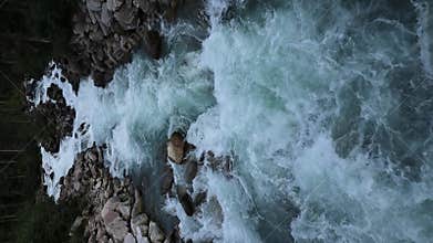 erial view of powerful mountain river rapids near Krimml Waterfalls in Austria - Turquoise water rushing between rocky