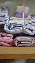 Stunning collection of neatly folded fabrics and soaps