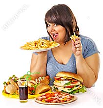 Woman eating fast food.