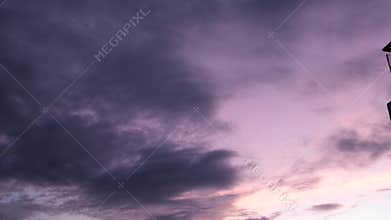 Cloudy purple sky Cumulus Clouds in Lilac Blue Sky in Sunlight at Sunset. Colorful Sunset Purple Skyscraper with