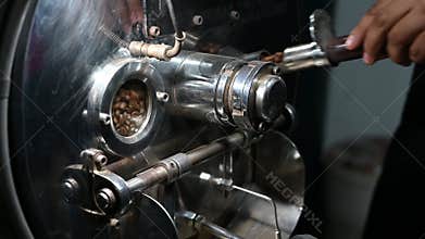 Coffee beans rotate in a coffee bean roasting machine.