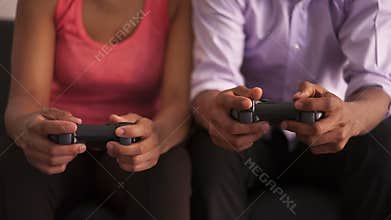 African American couple playing video games