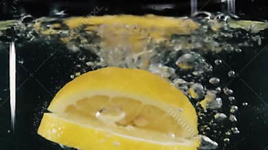Lemon Slice Splashing into Water in Slow Motion