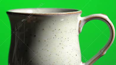 Close-up Ceramic Mug Against Green Screen
