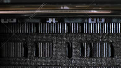 The process of printing a color inkjet printer in close-up. The rolles is rolling inside of device and printed a picture