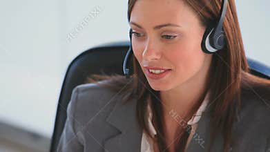 Business woman speaking over the headset