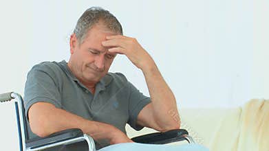 A despair man in a wheelchair