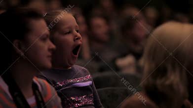 Bored girl in the auditorium