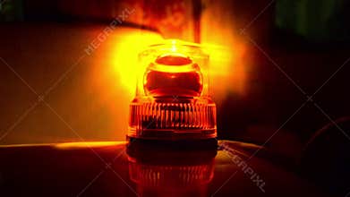 Flashing beacon. Orange flashing and revolving light.