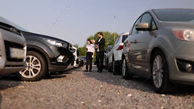 Car Dealer Showing Vehicle to Customer