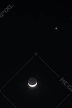 Earthshine is a soft, faint glow on the dark side of the moon.